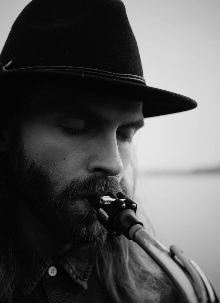 Close-up of Björn playing, the mouthpiece in focus